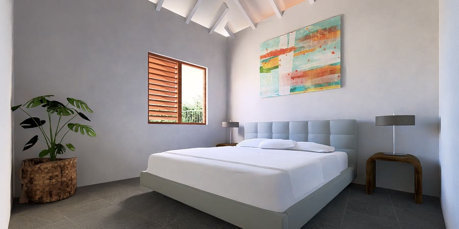 Tweede slaapkamer met kunstwerk boven het bed