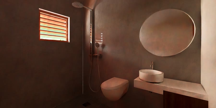 Badkamer afgewerkt in terracotta stucwerk, met ronde spiegel
